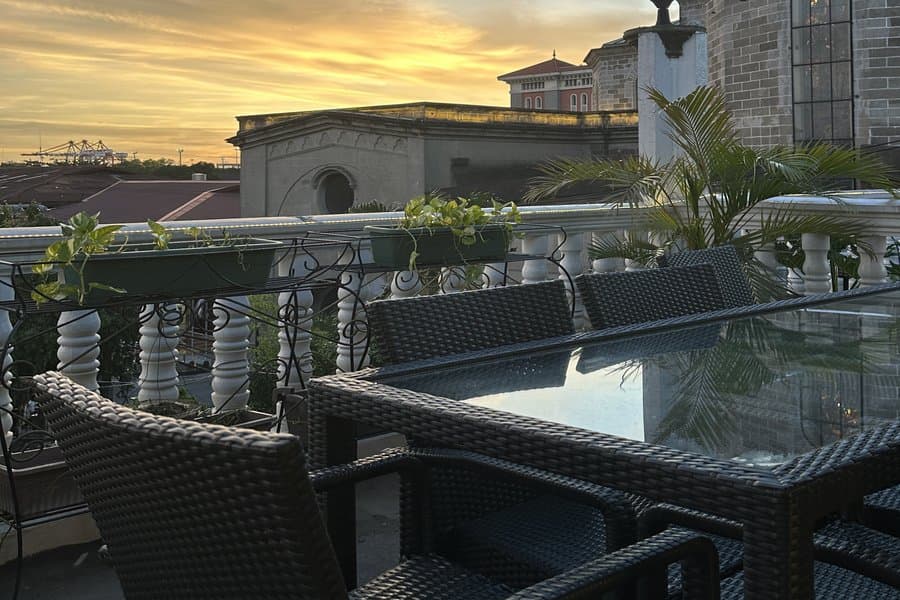 Rooftop restaurant seating at sunset